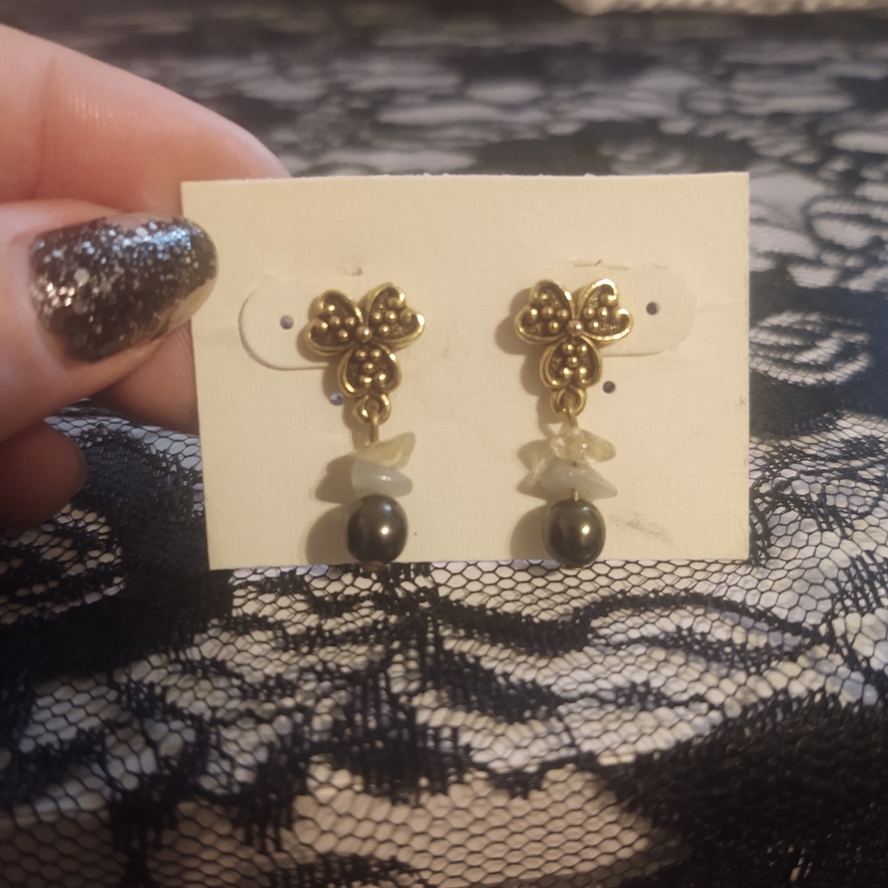 Gold and black earrings.